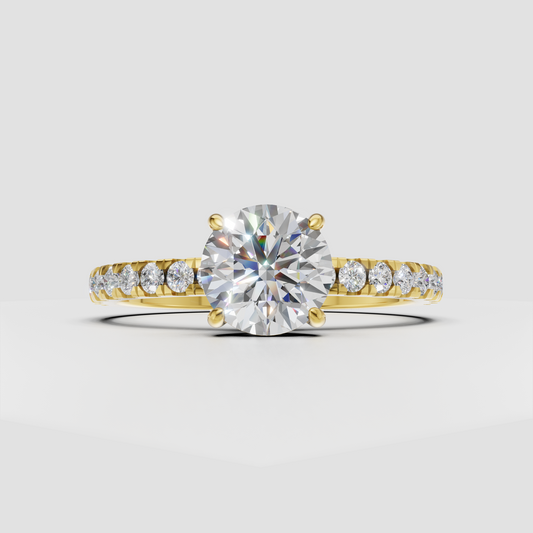 Round cut diamond four-prong pavé engagement ring in yellow gold