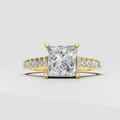 Princess cut diamond engagement ring with four prong yellow gold setting