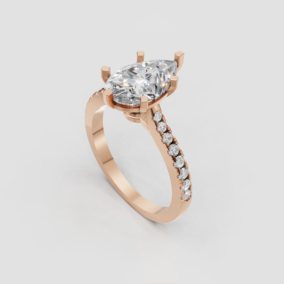 Detailed pear diamond ring showcasing cathedral-style raised shoulders
