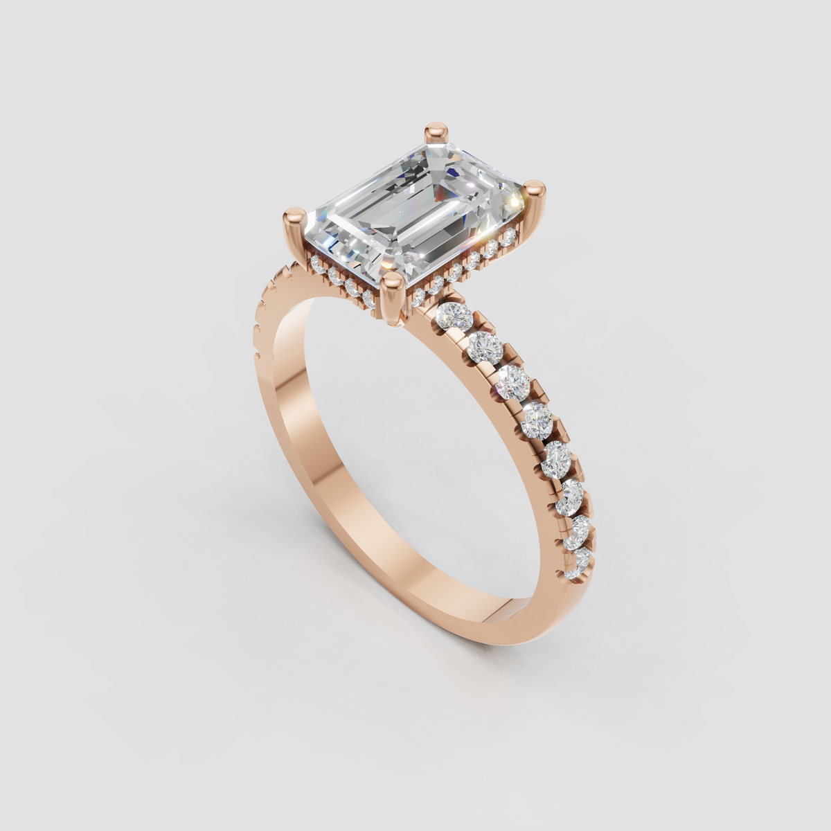 Polished yellow gold ring with emerald cut diamond and pavé accents