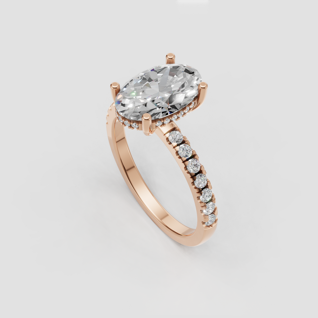 Oval diamond bridal ring with pavé-set yellow gold band