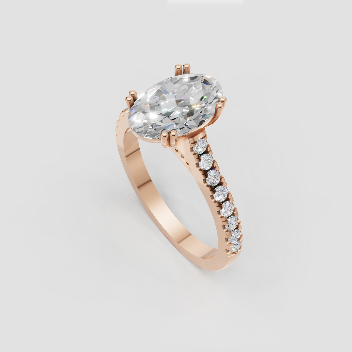Oval diamond ring with delicate pave side stones and polished shank