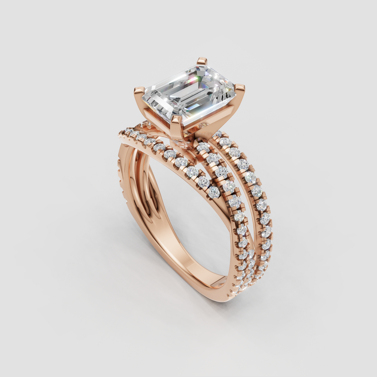 Emerald cut center stone ring with four-prong rose gold setting