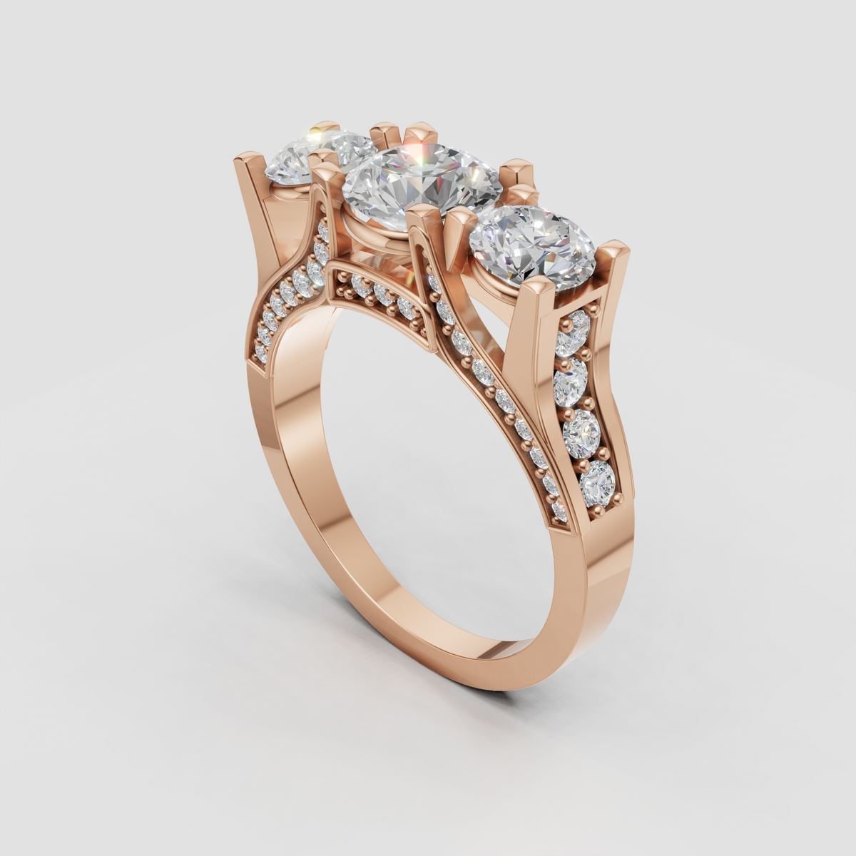 Three-stone diamond ring with diamond-accented gallery and shoulders