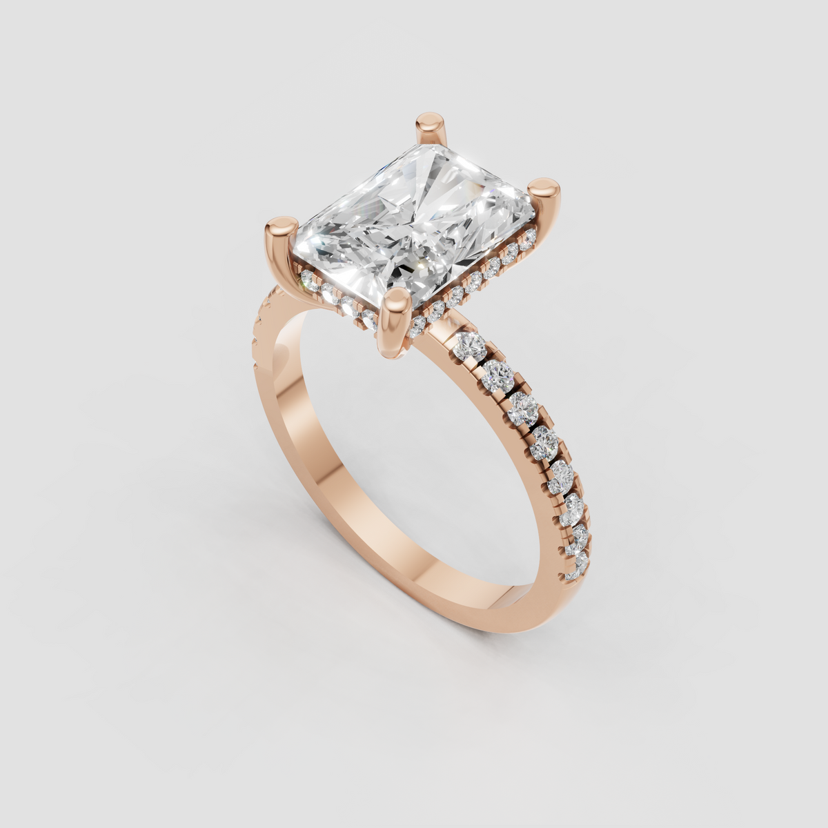 Radiant diamond ring featuring a pavé accent band