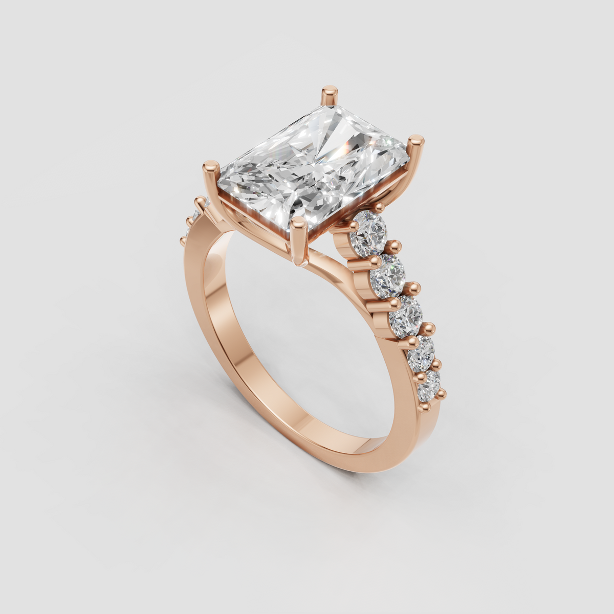 Luxury radiant engagement ring with sculptural yellow gold shoulders