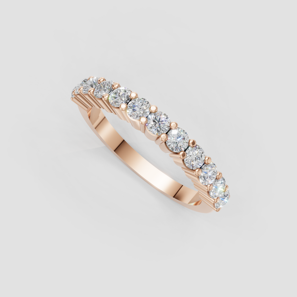 Round cut diamond eternity ring with delicate rounded gold prongs between stones