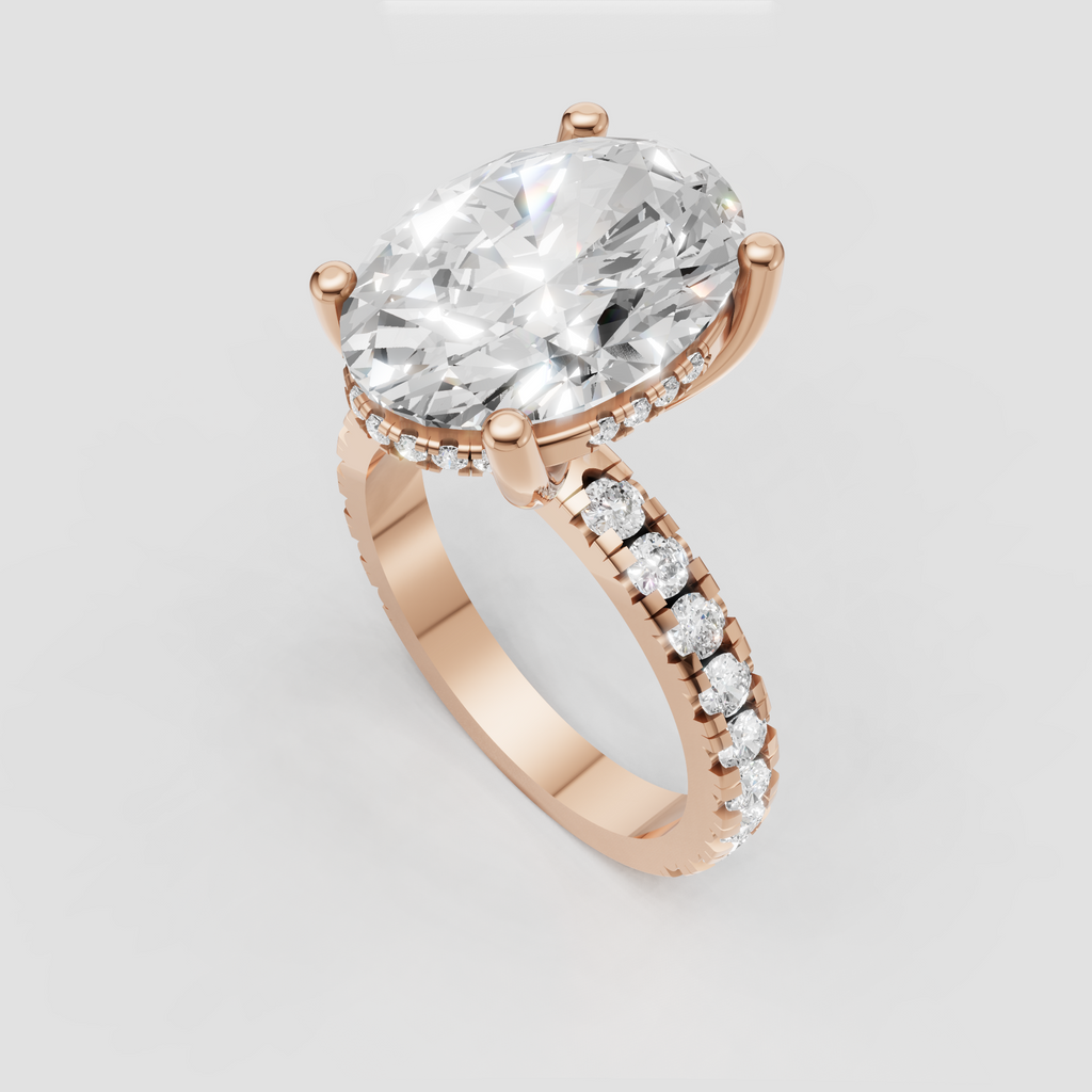 Four-prong oval diamond engagement ring in yellow gold