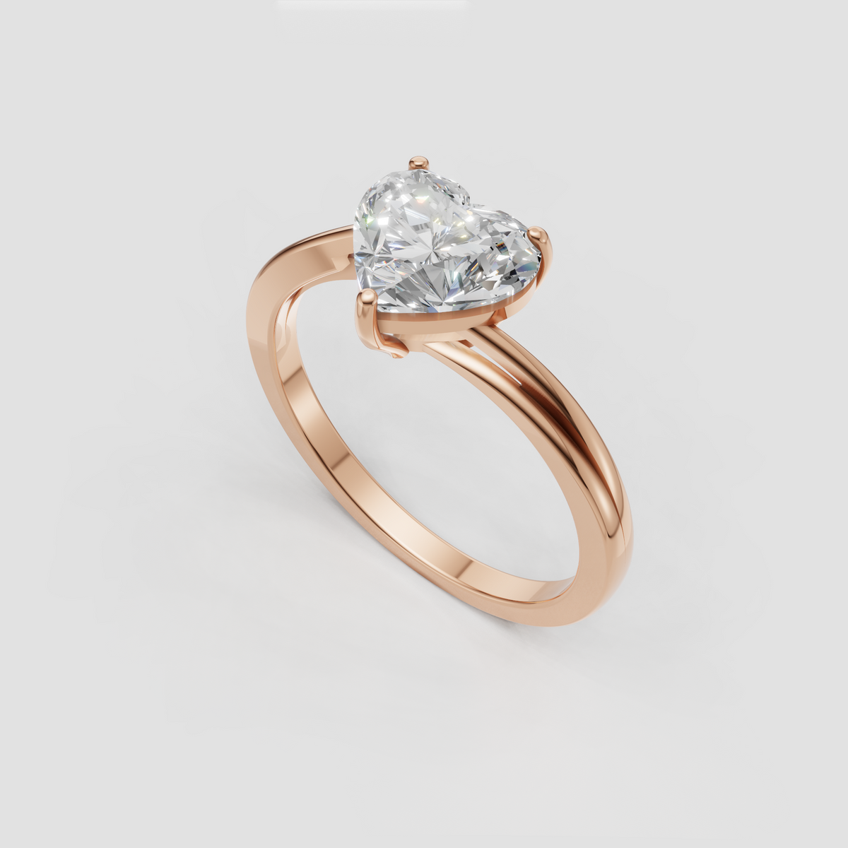 Polished yellow gold ring featuring a brilliant heart shaped center stone