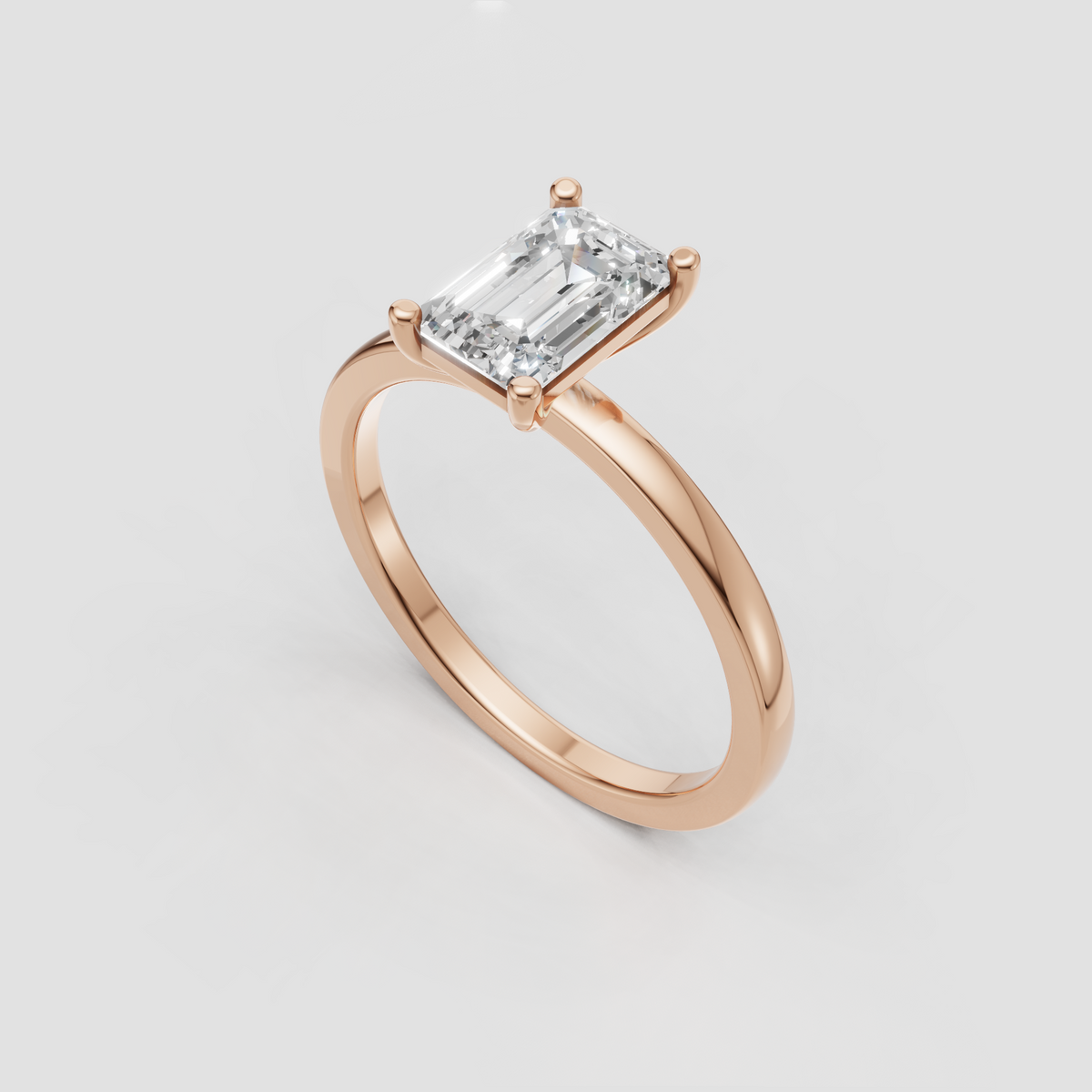 Four prong emerald cut diamond solitaire ring