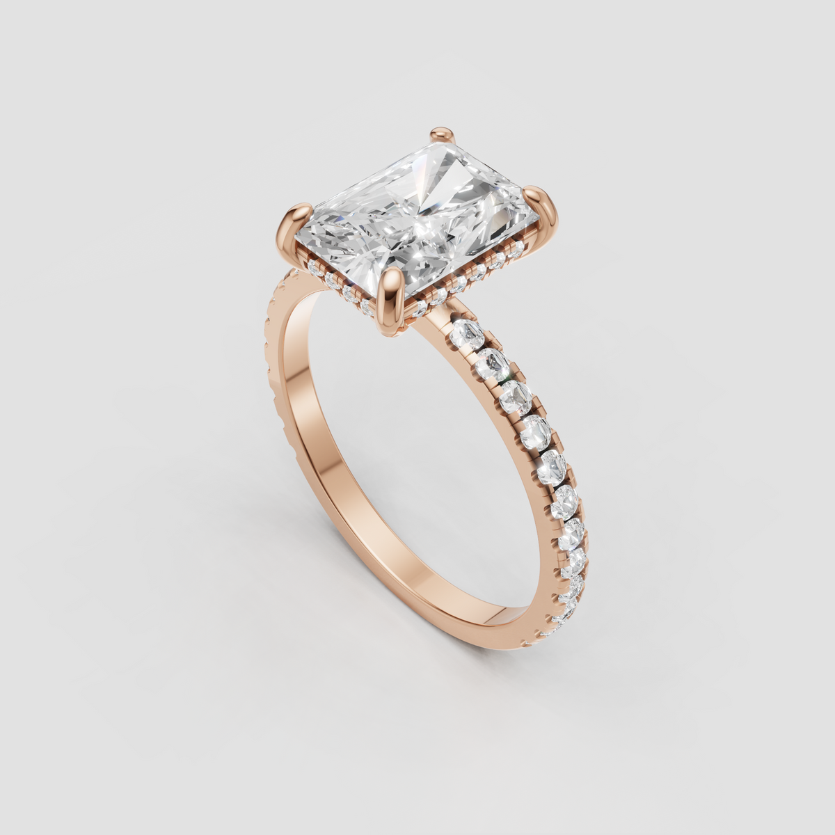 Radiant diamond engagement ring with sparkling stones beneath canter