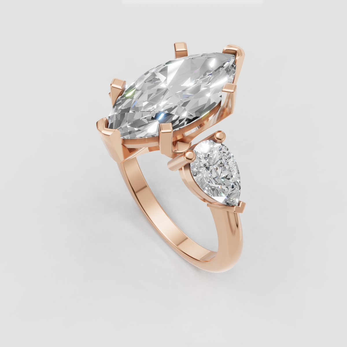 Marquise and pear diamond engagement ring in prong setting
