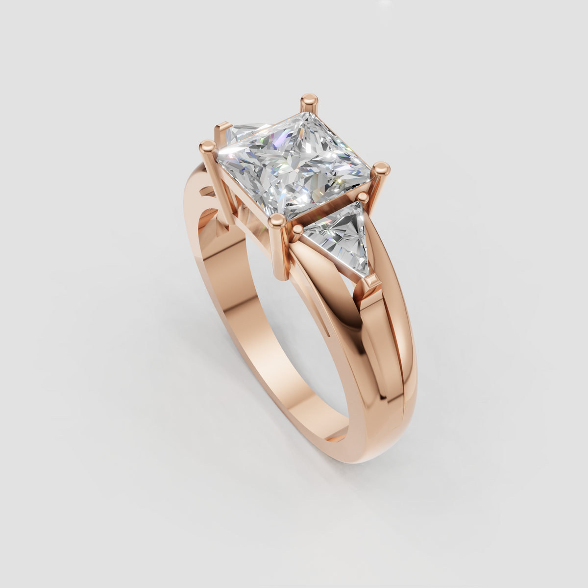 Yellow gold princess cut three stone ring viewed from the front