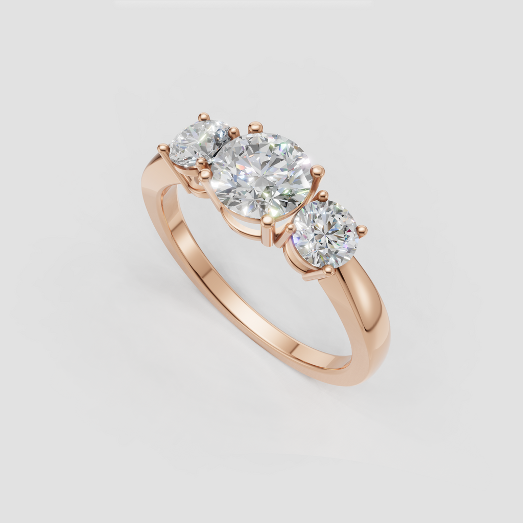 Front view of round-cut Diamond trilogy engagement ring with prongs