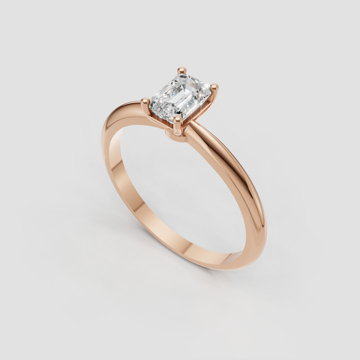 Polished yellow gold ring with emerald cut diamond center stone