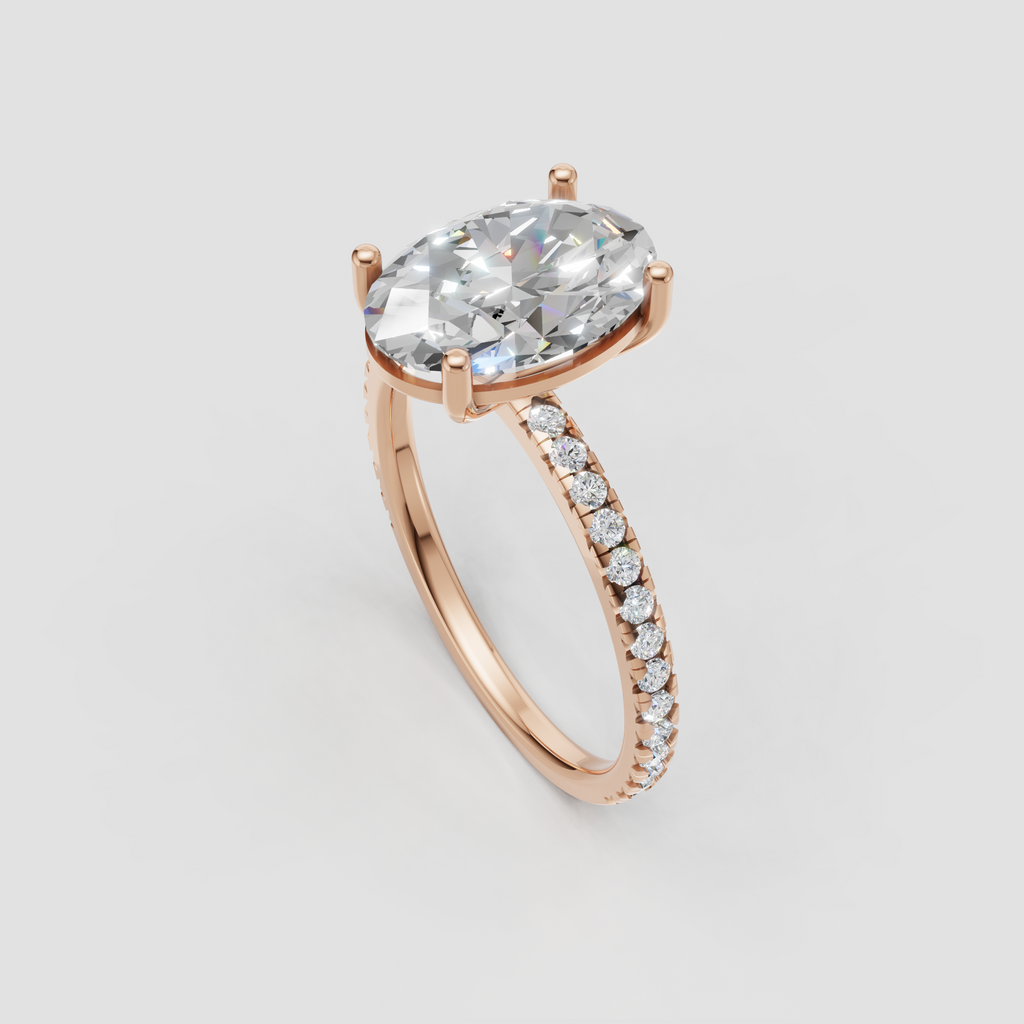 Side view of oval diamond cathedral engagement ring in yellow gold