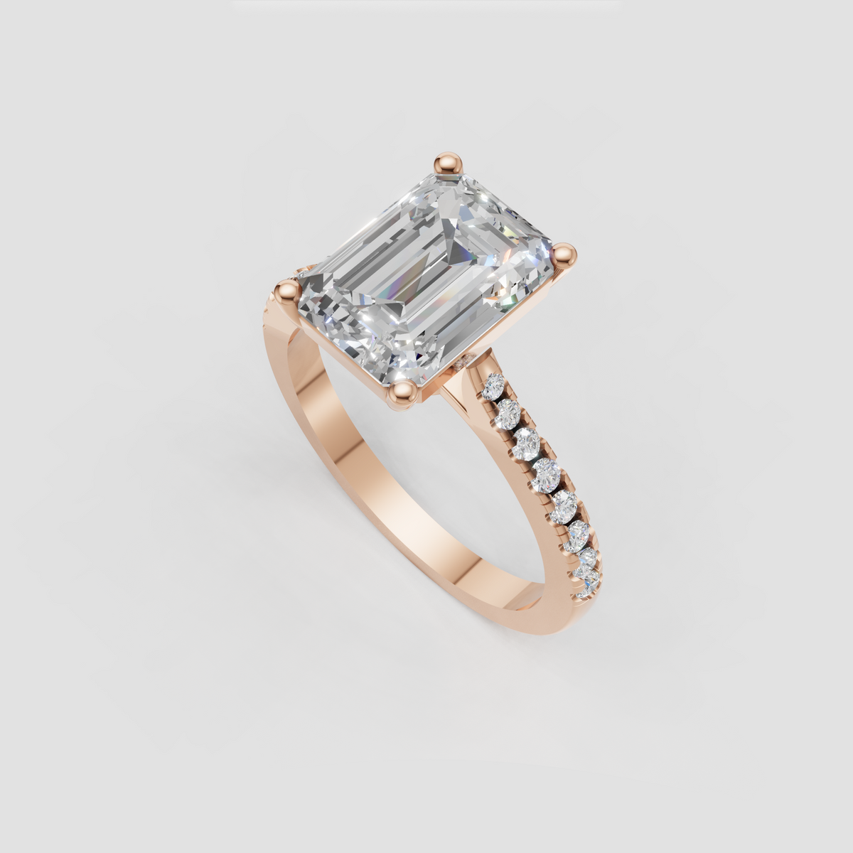 Sophisticated emerald cut engagement ring with diamond pavé band