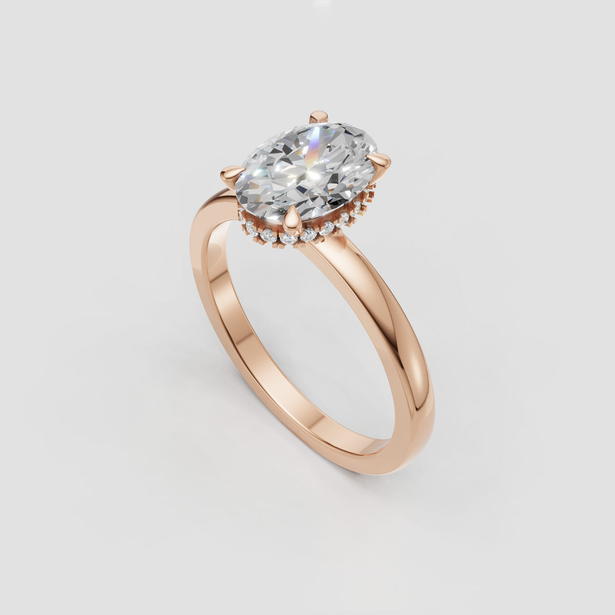 Oval center diamond with four-prong setting and hidden halo