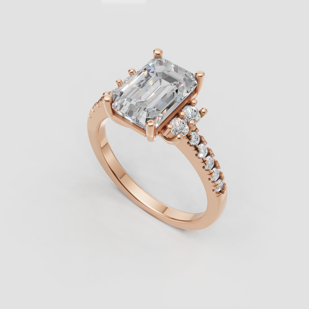 Emerald cut diamond ring featuring round clustered accent stones