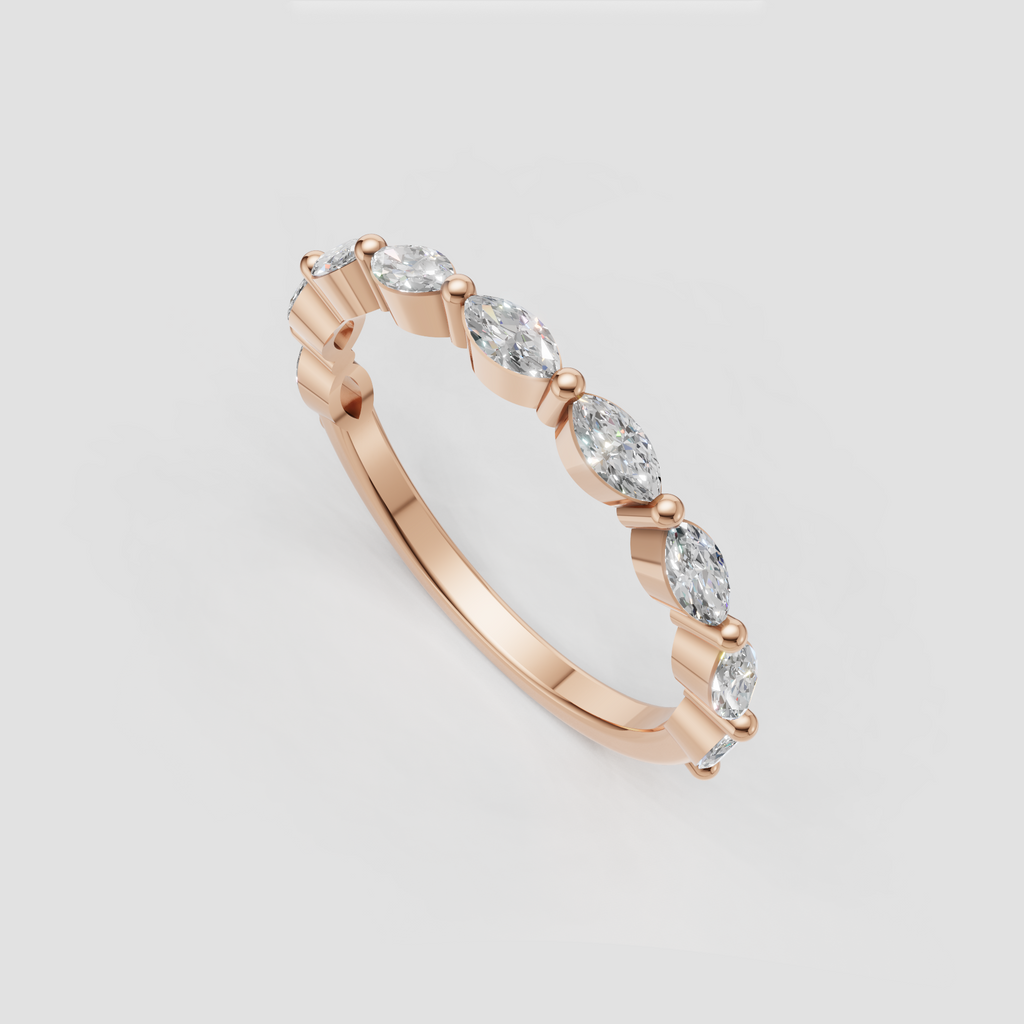 Yellow gold marquise eternity ring with sculpted stone settings