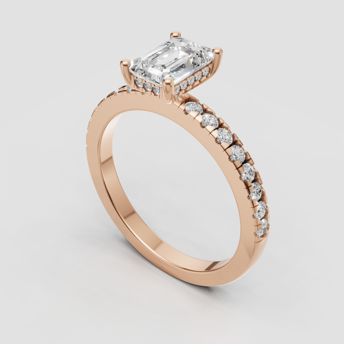 Modern classic emerald cut diamond engagement ring with round side stones