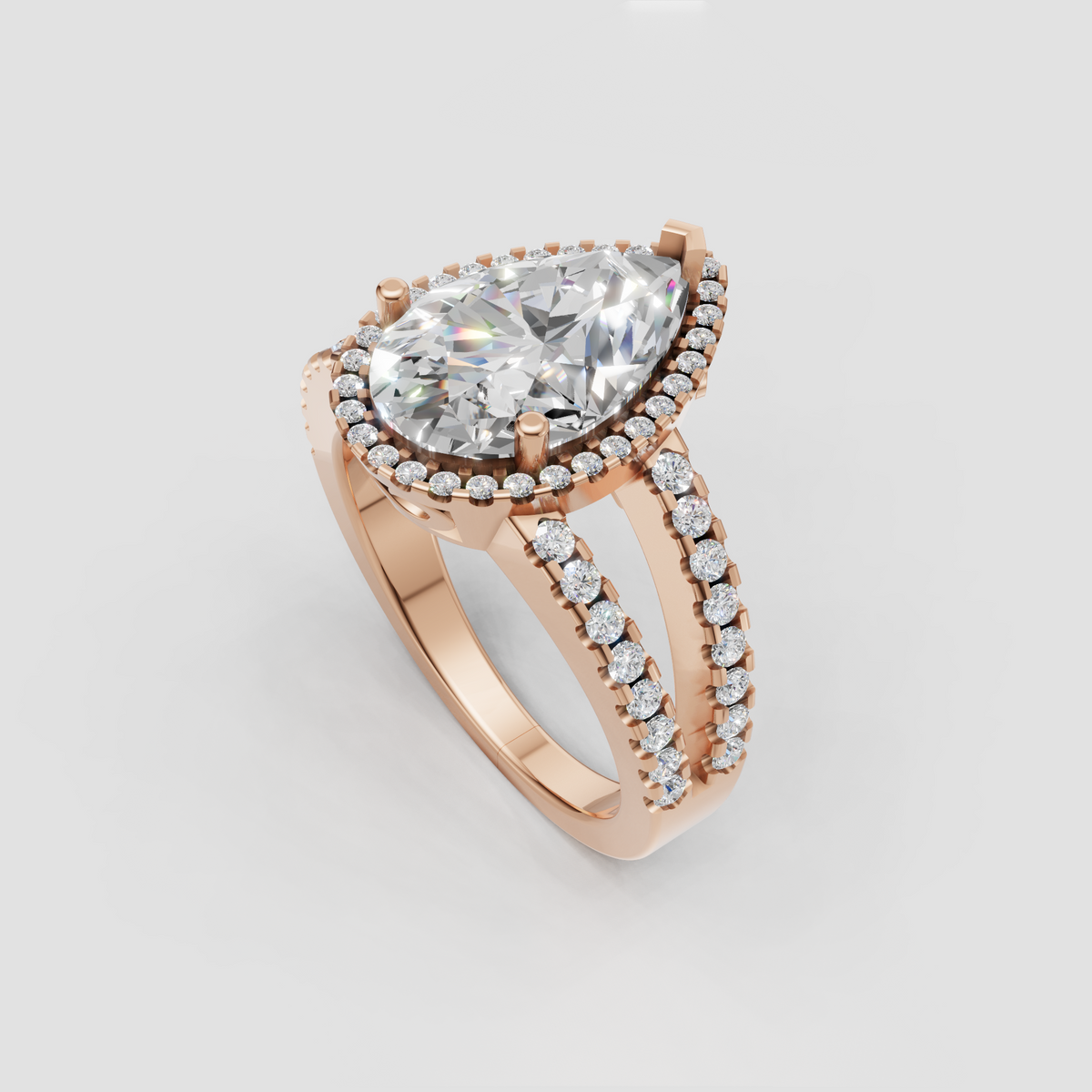 Teardrop diamond engagement ring with halo and split-shank design