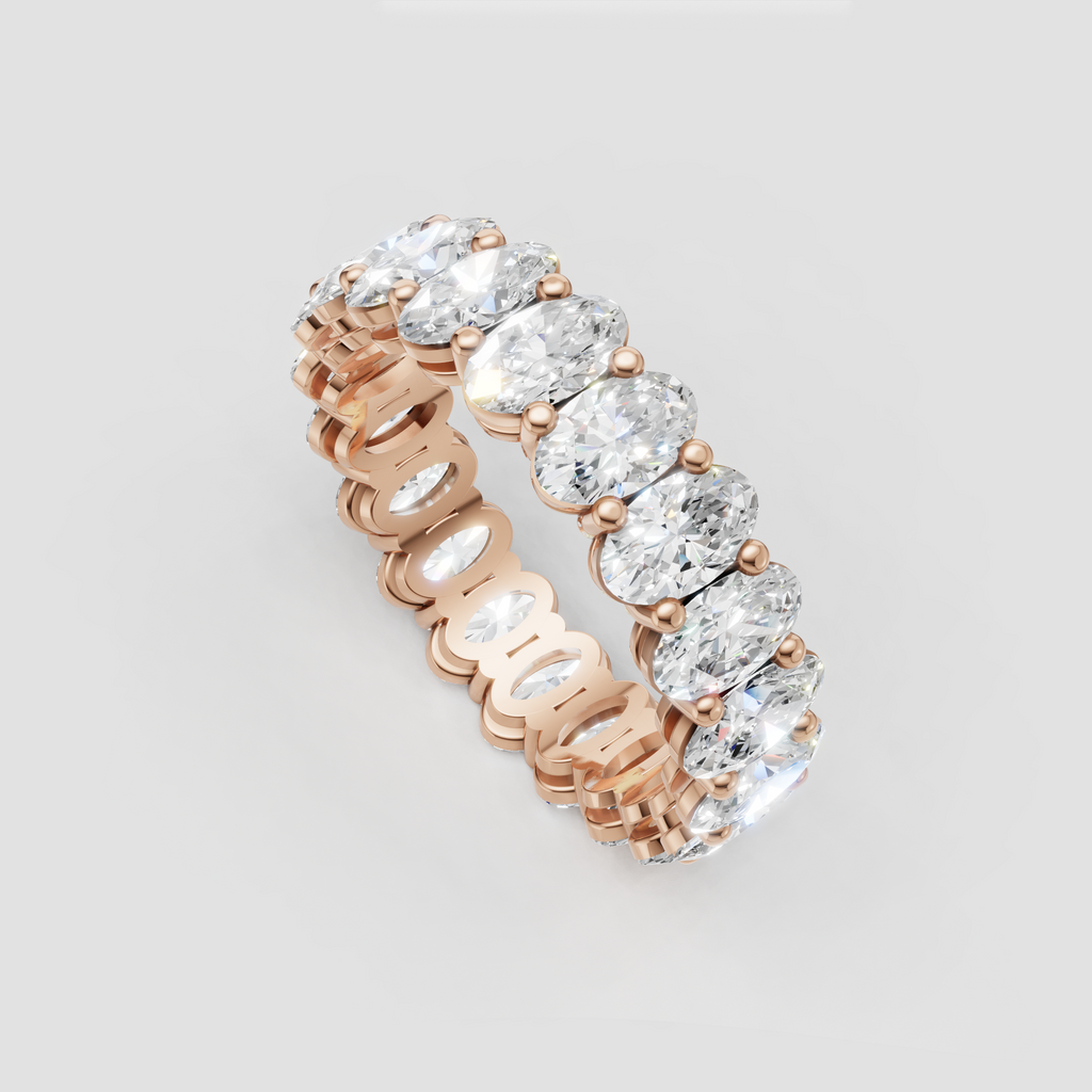 Oval diamond wedding band with closely set gemstones