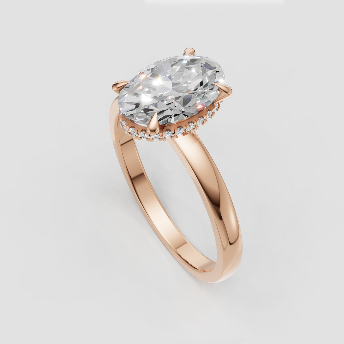 Close-up of oval cut diamond hidden halo engagement ring