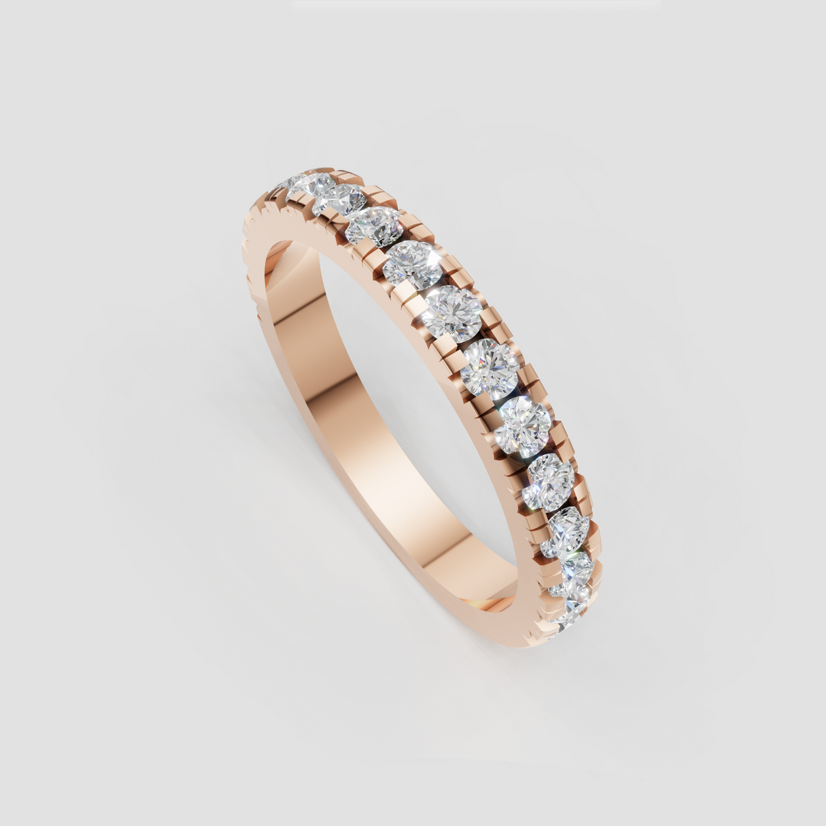Round brilliant eternity ring with symmetrical shared-prong design