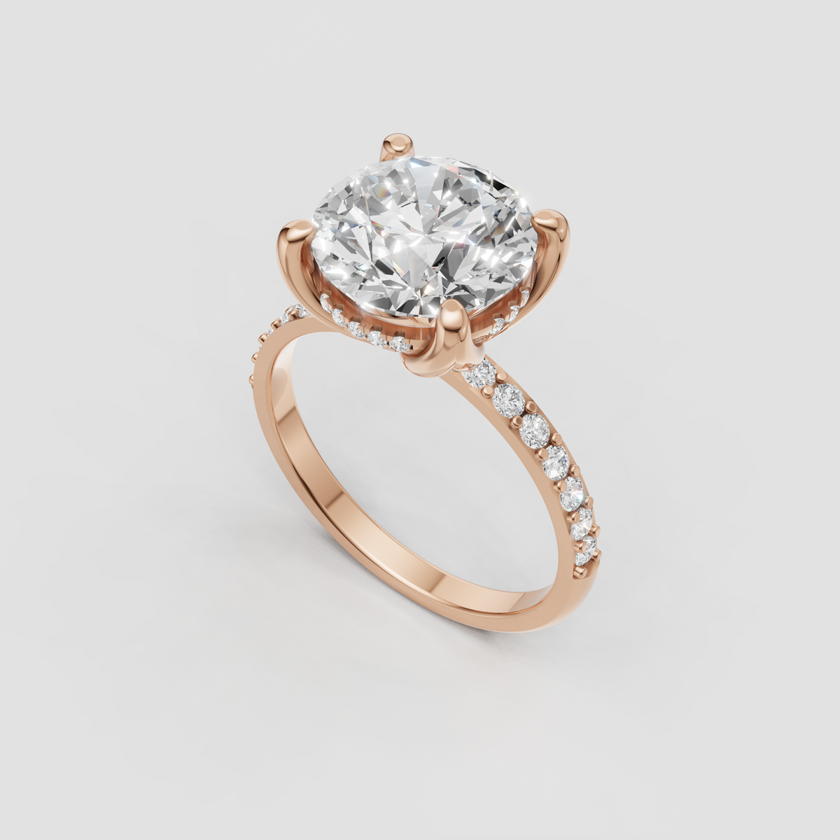 Round brilliant Diamond engagement ring with pavé shoulders and hidden accent stones