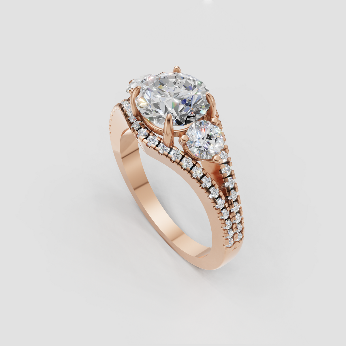 Three stone diamond engagement ring with pavé shoulders