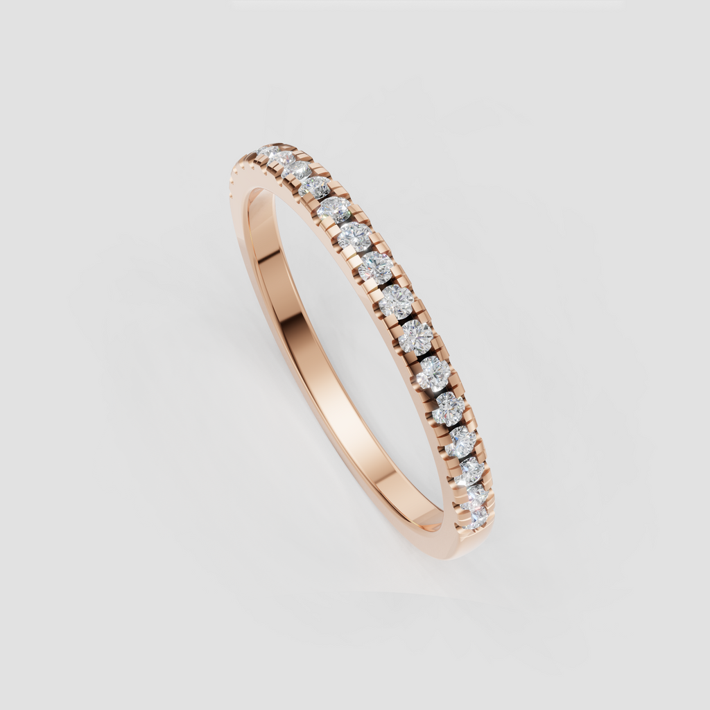 Side view of slim round diamond yellow gold band ring