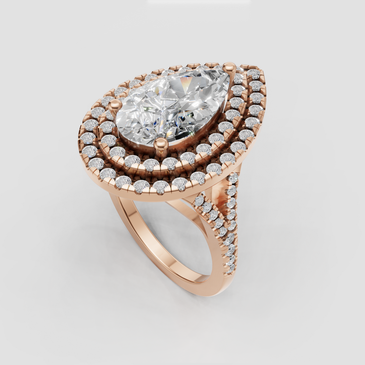 Ornate pear cut diamond ring with pavé side detailing