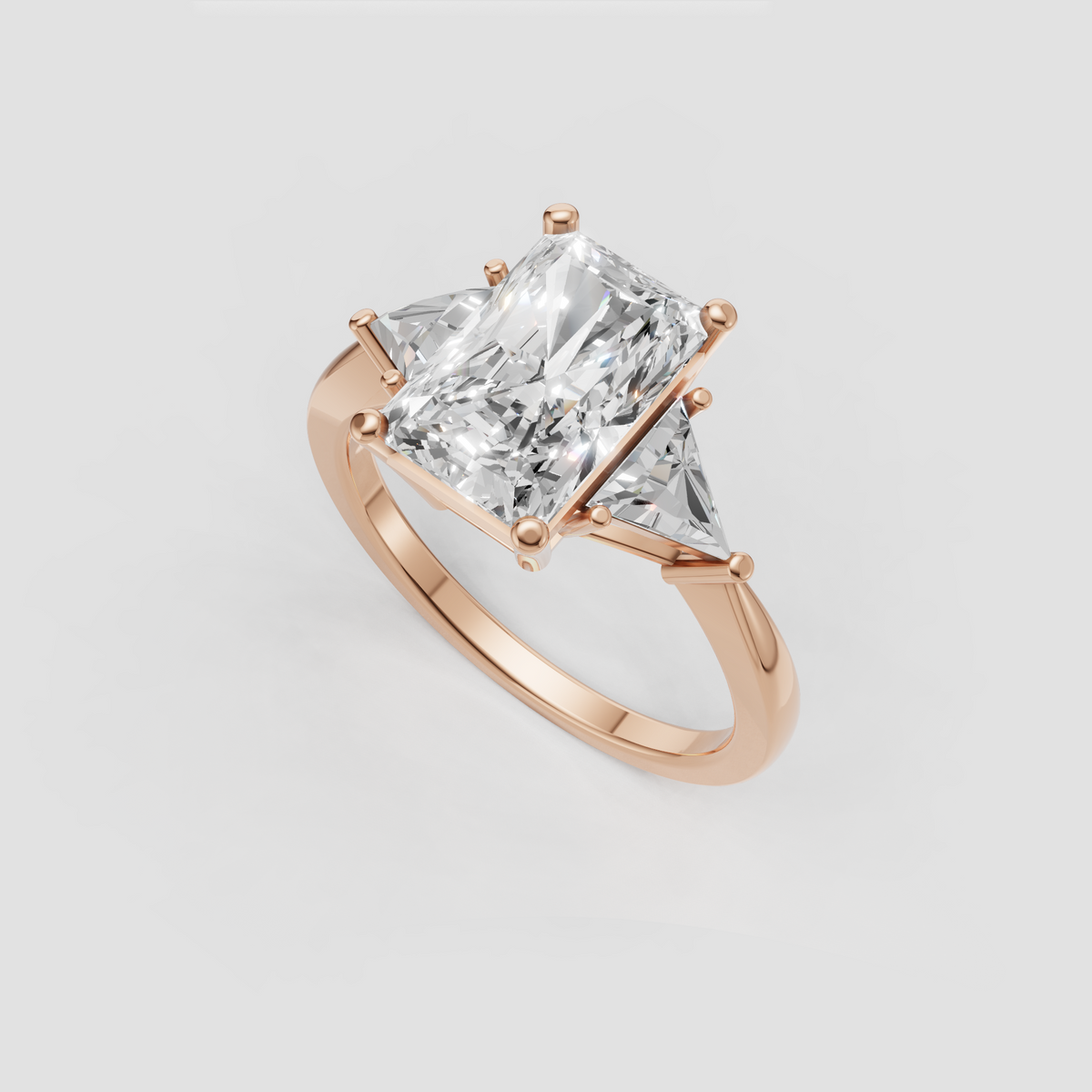 Radiant cut engagement ring with rectangular center stone and trillion side accents