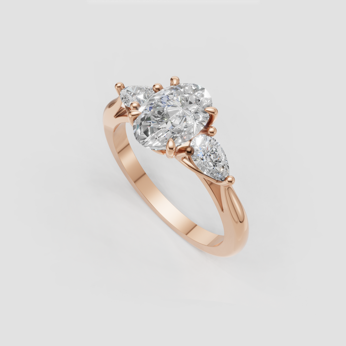 Oval diamond ring featuring two side stones and polished gold band