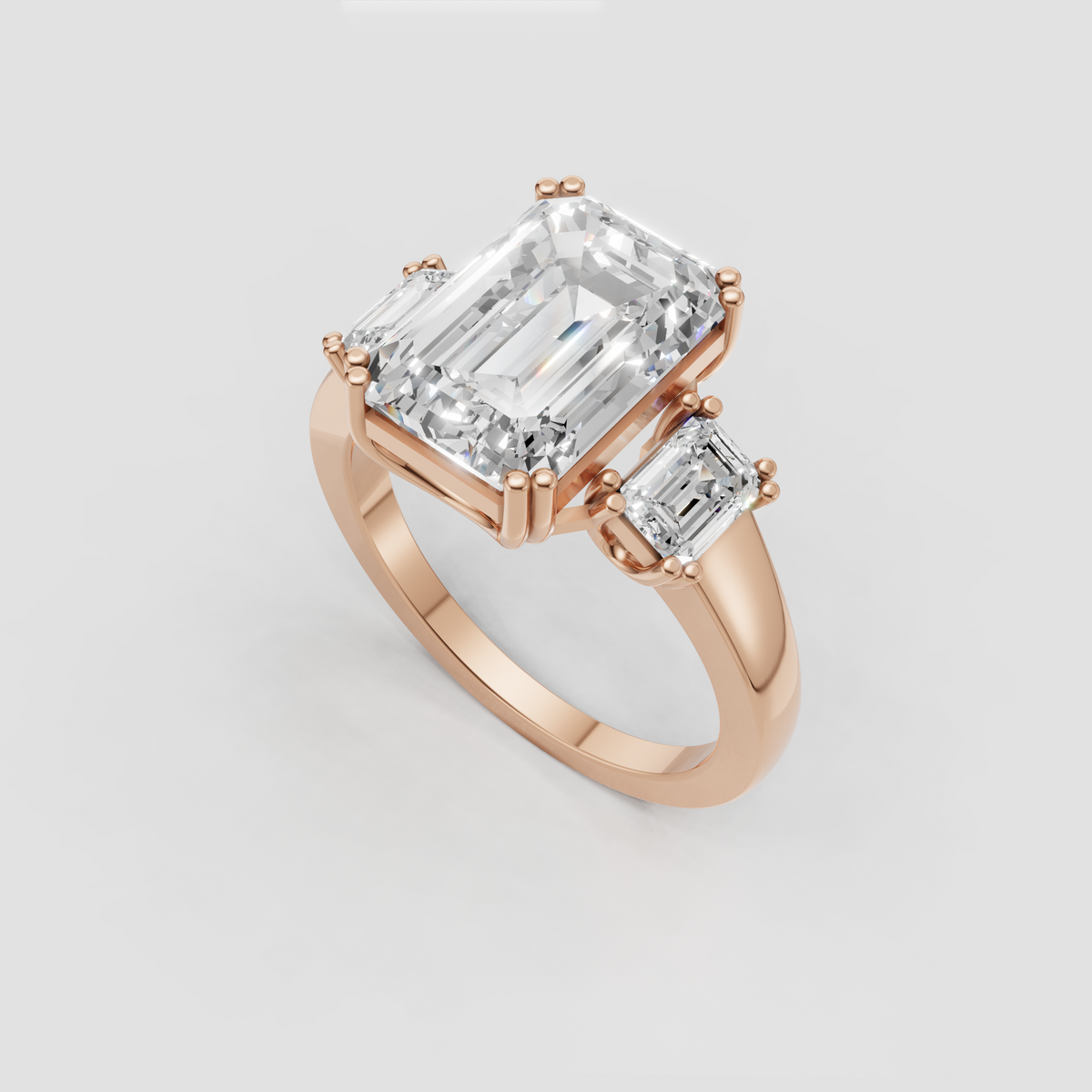 Modern emerald cut diamond engagement ring with prongs