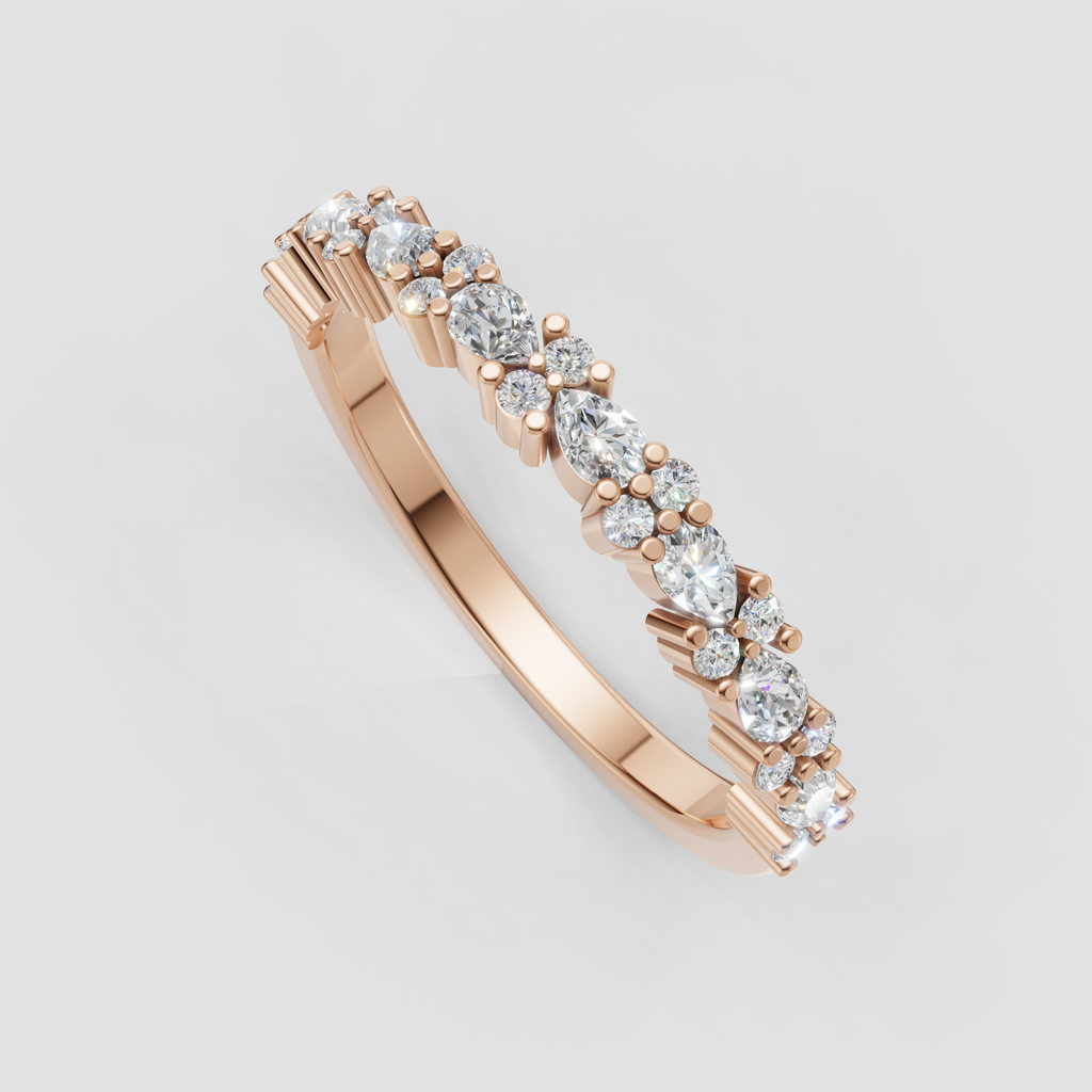 Close-up of round and pear diamonds secured in prong settings