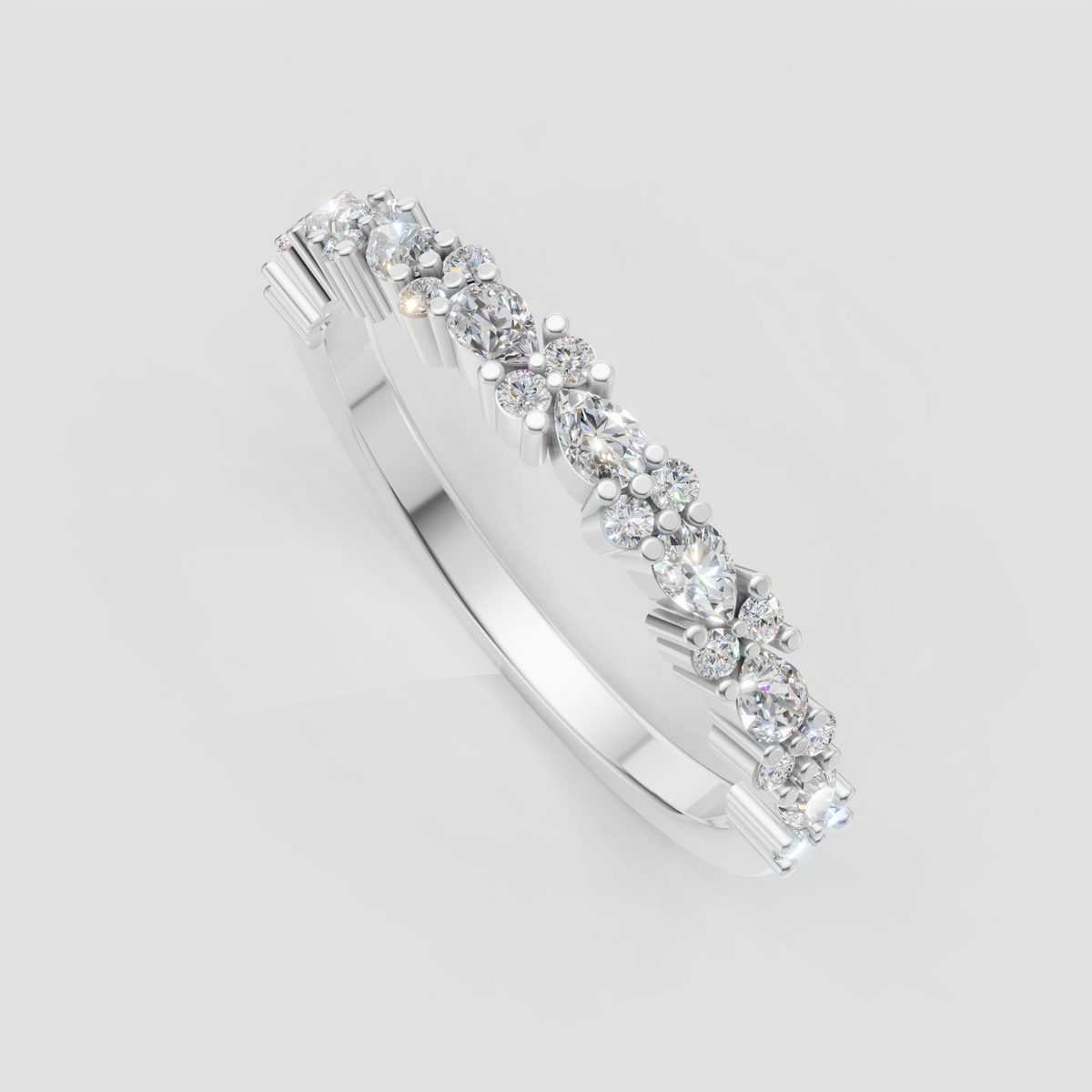 Round and pear shaped diamond wedding ring with detailed prongs
