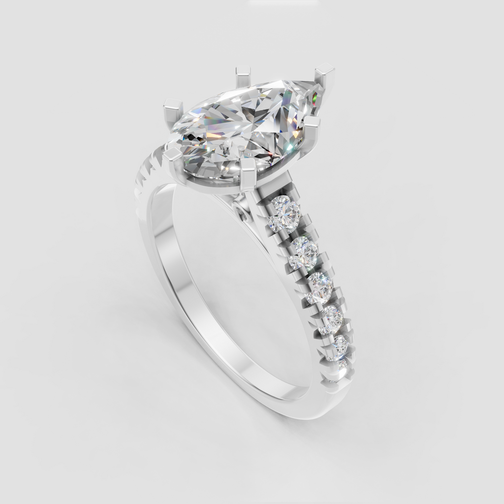 Close-up pear shaped diamond ring showcasing six-prong center setting and cathedral-style pavé shoulders.