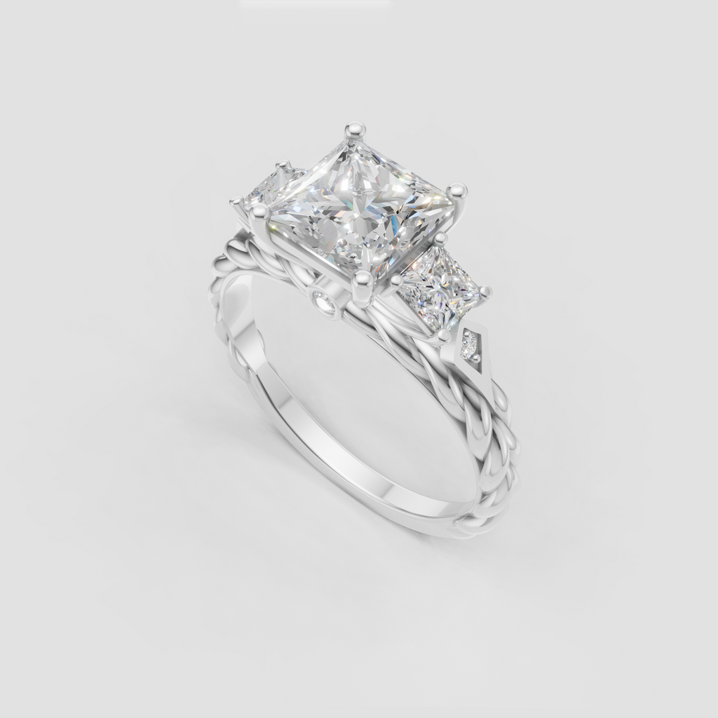 Princess cut three stone ring with intricate yellow gold detailing
