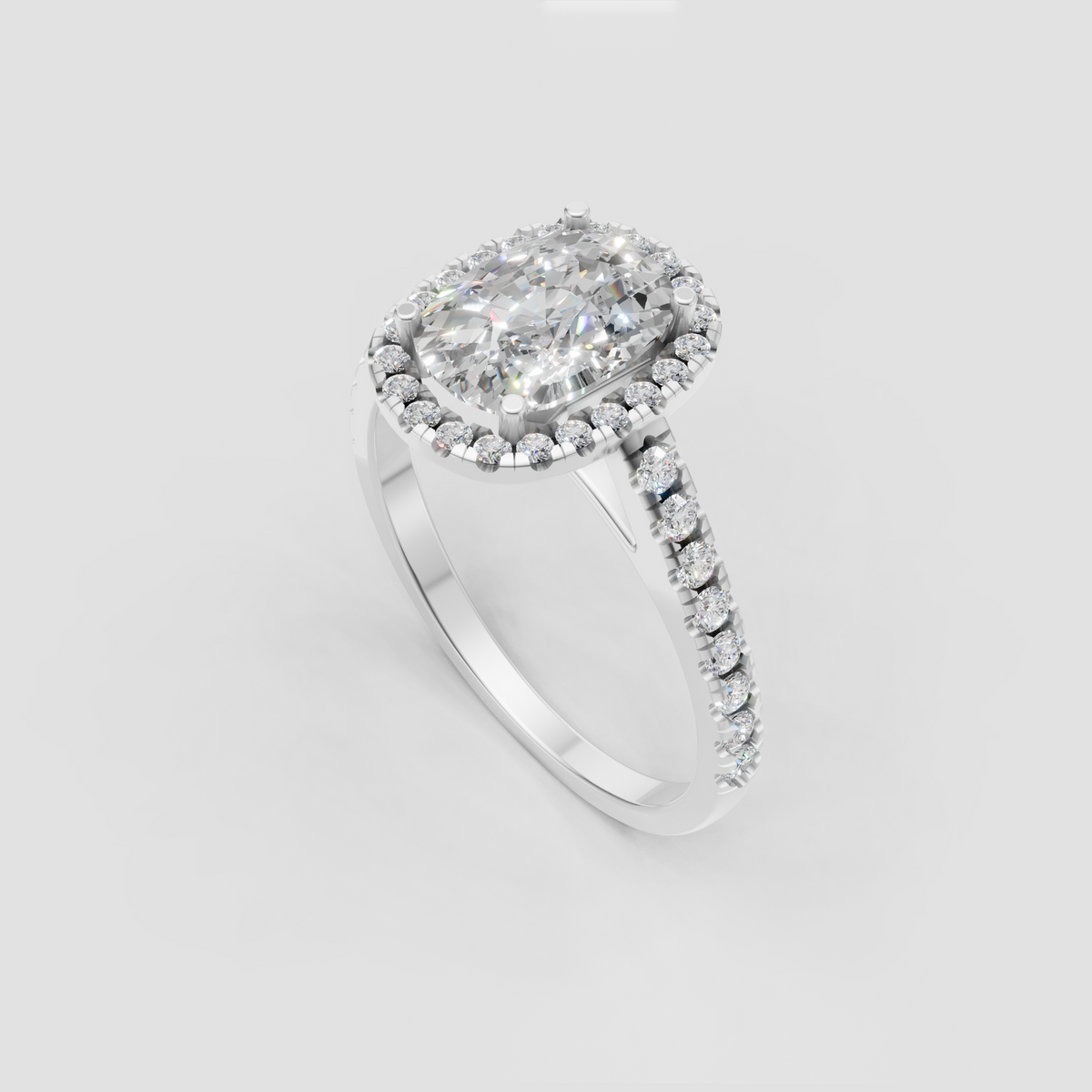 Elongated cushion diamond halo ring with four-prong center setting