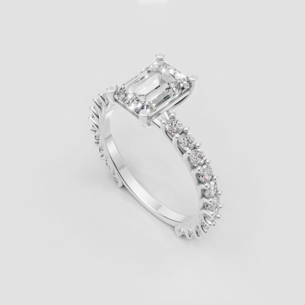 Emerald cut engagement ring with continuous round side stones