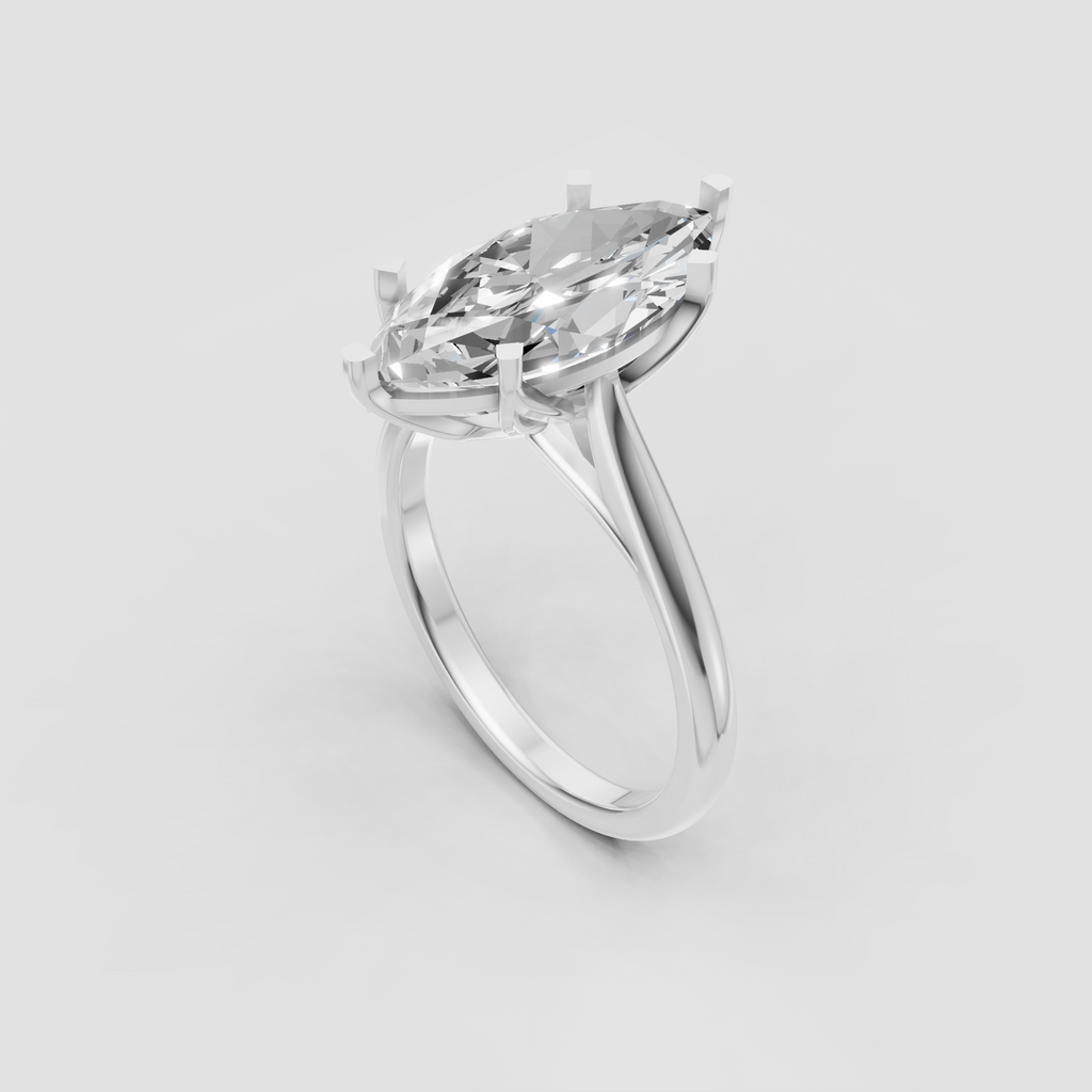 Marquise cut centre stone secured by four elegant prongs