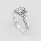 Yellow gold halo engagement ring with pavé-set diamond shoulders