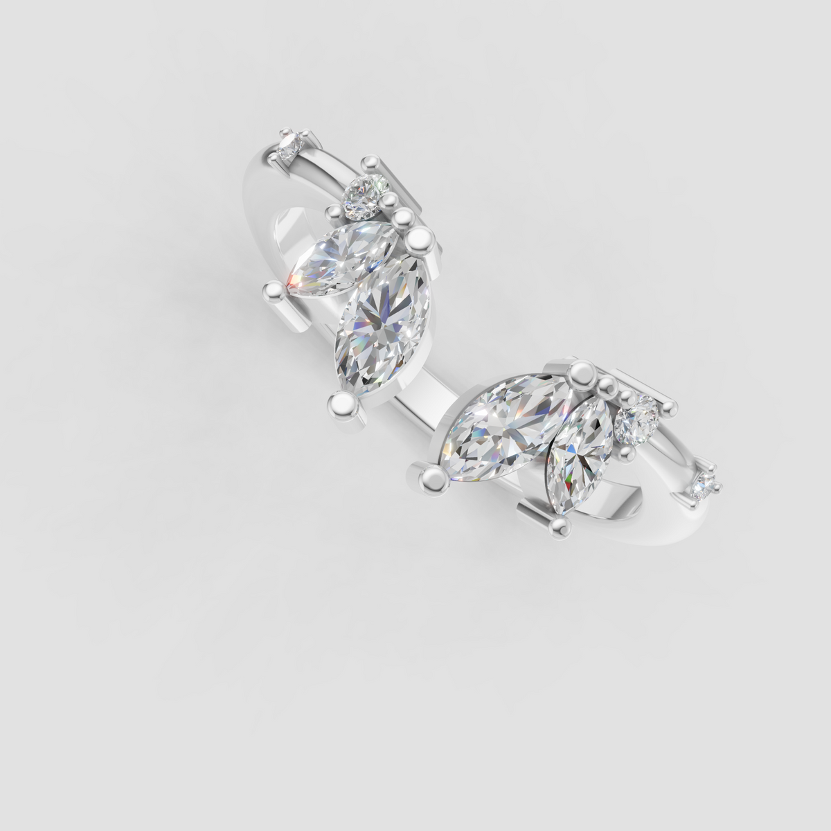 Marquise and round diamond band with delicate prong details