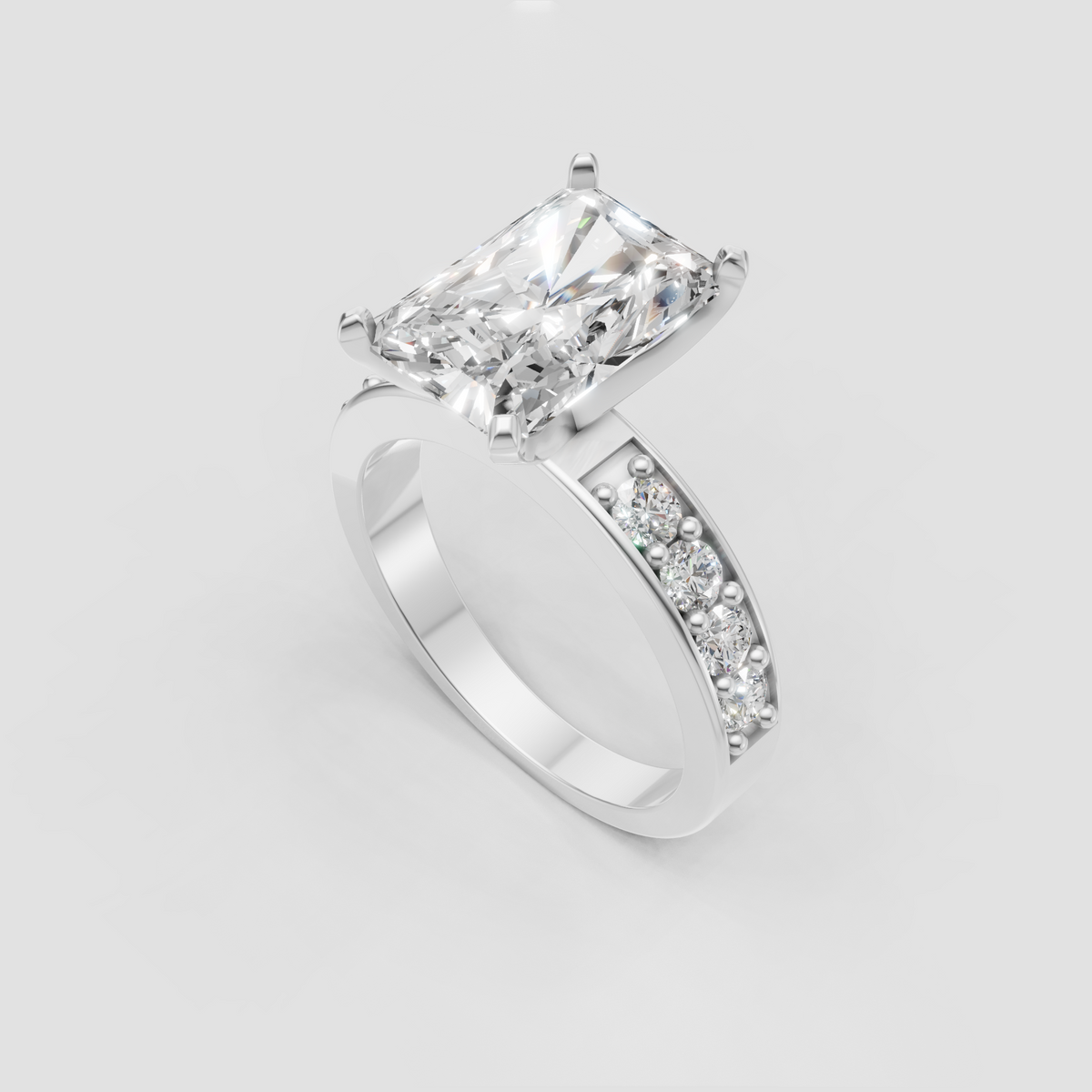 Radiant diamond ring featuring a row of round accent stones