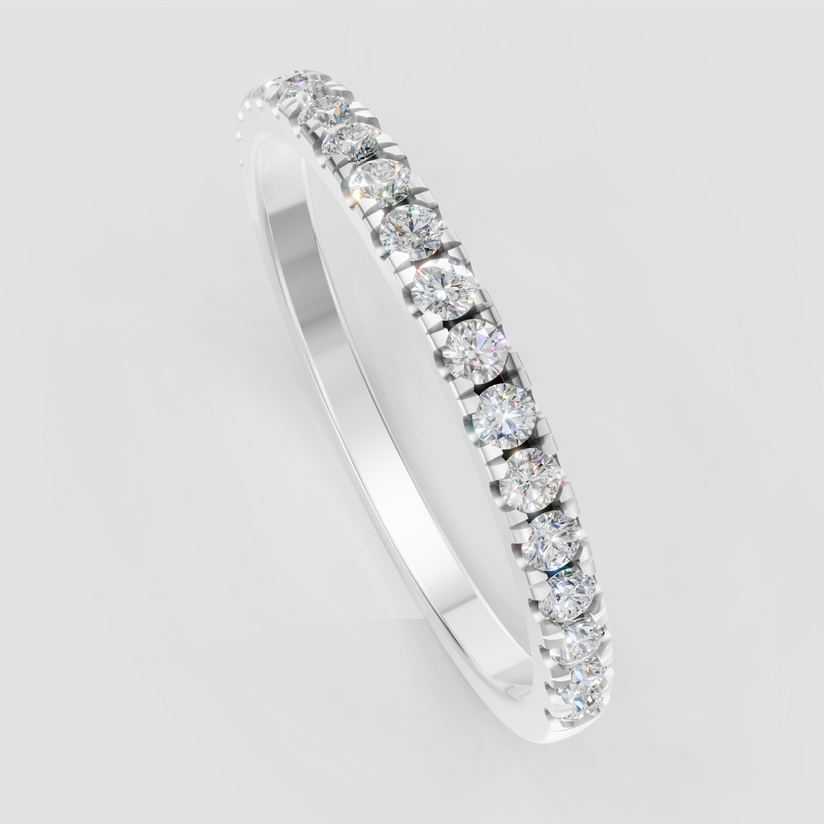 Round diamond half eternity ring featuring sparkling accent stones