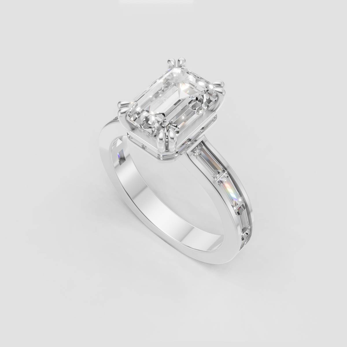 Emerald diamond solitaire ring with four-prong setting and architectural baguette accents