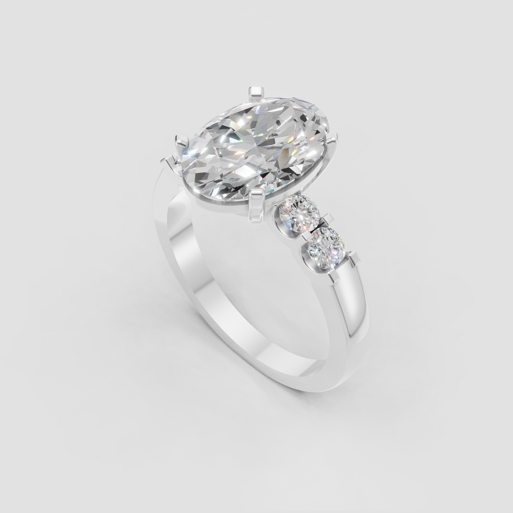 Oval diamond ring featuring round side stones and classic prong setting