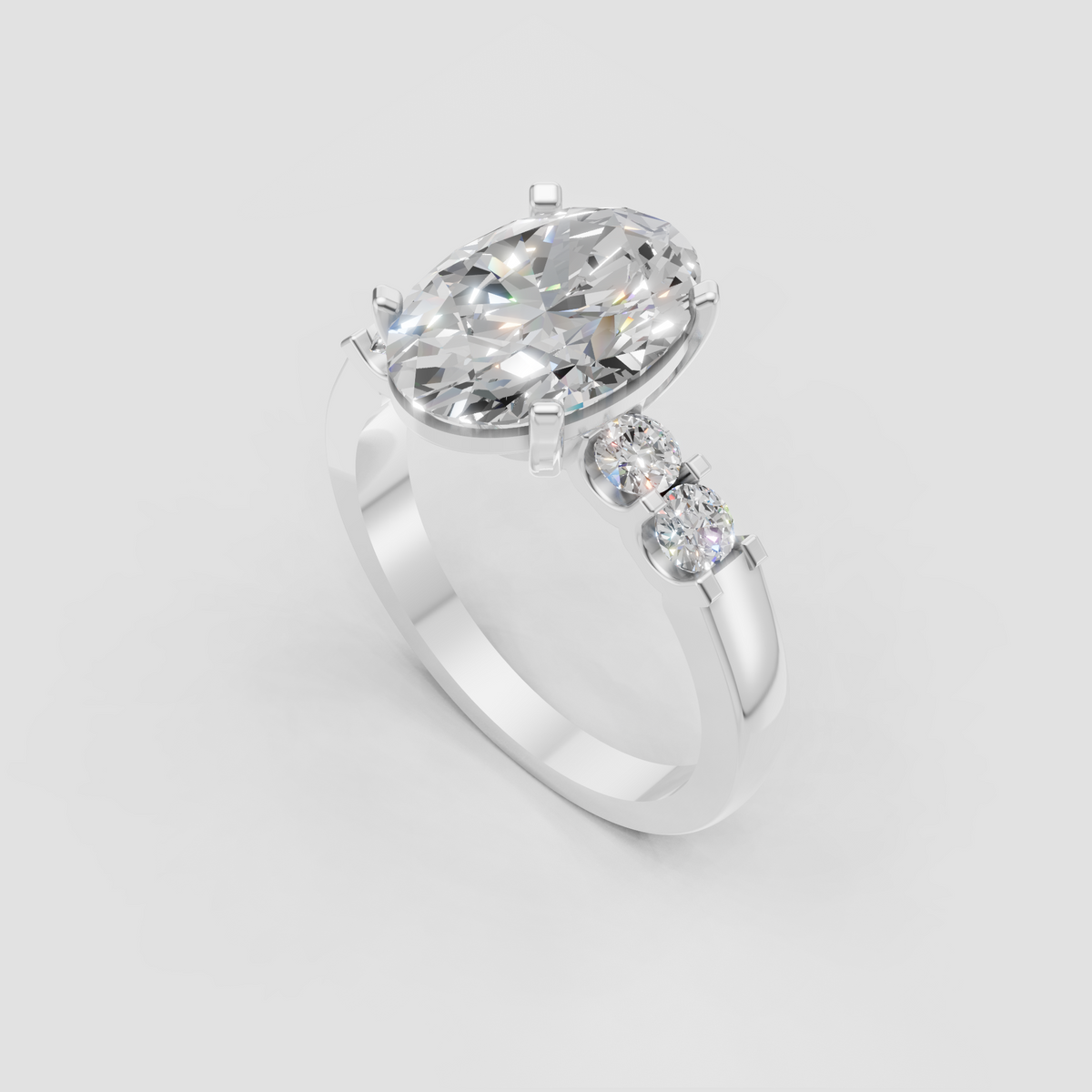 Oval diamond ring featuring round side stones and classic prong setting